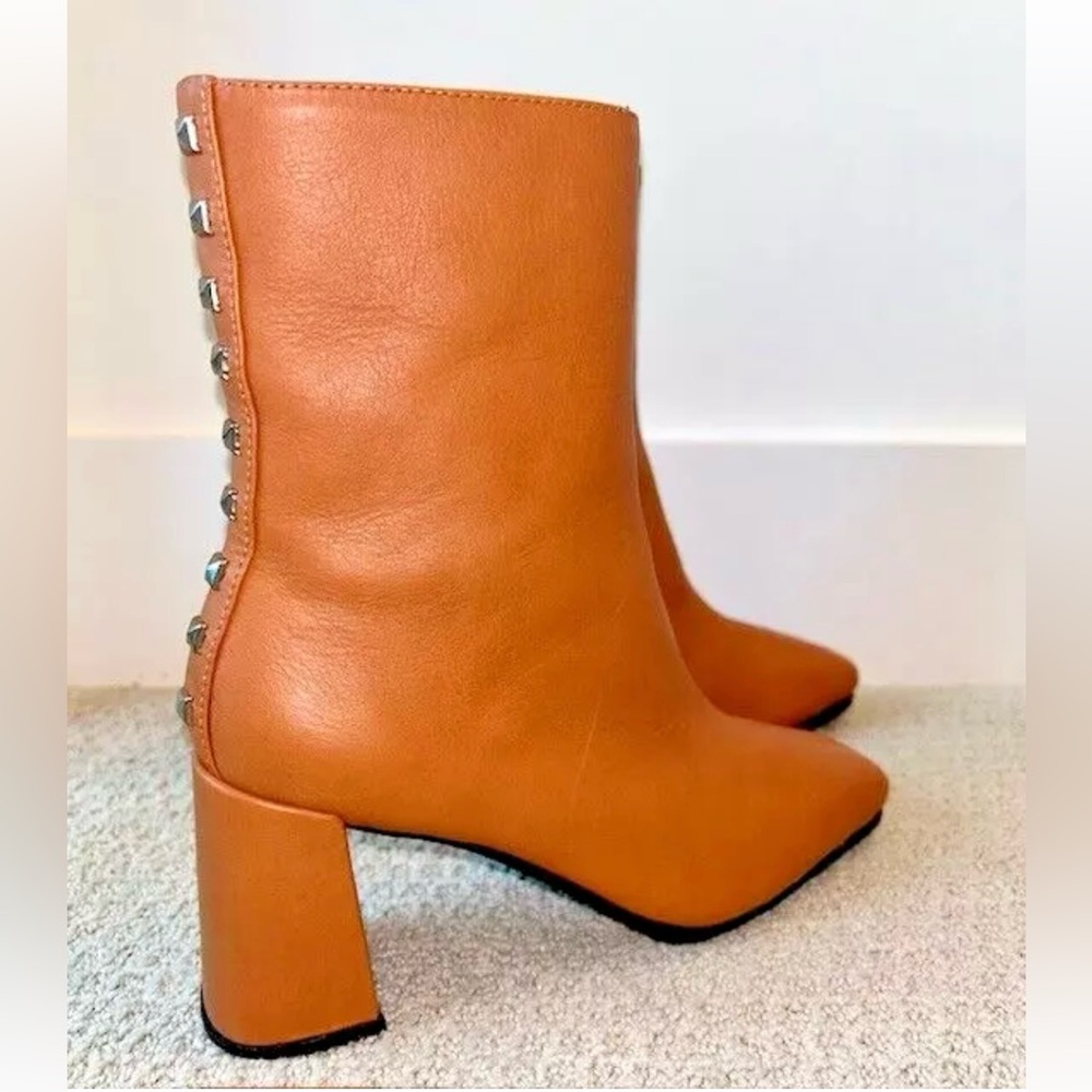 Paruolo embossed leather calf-high boots.
